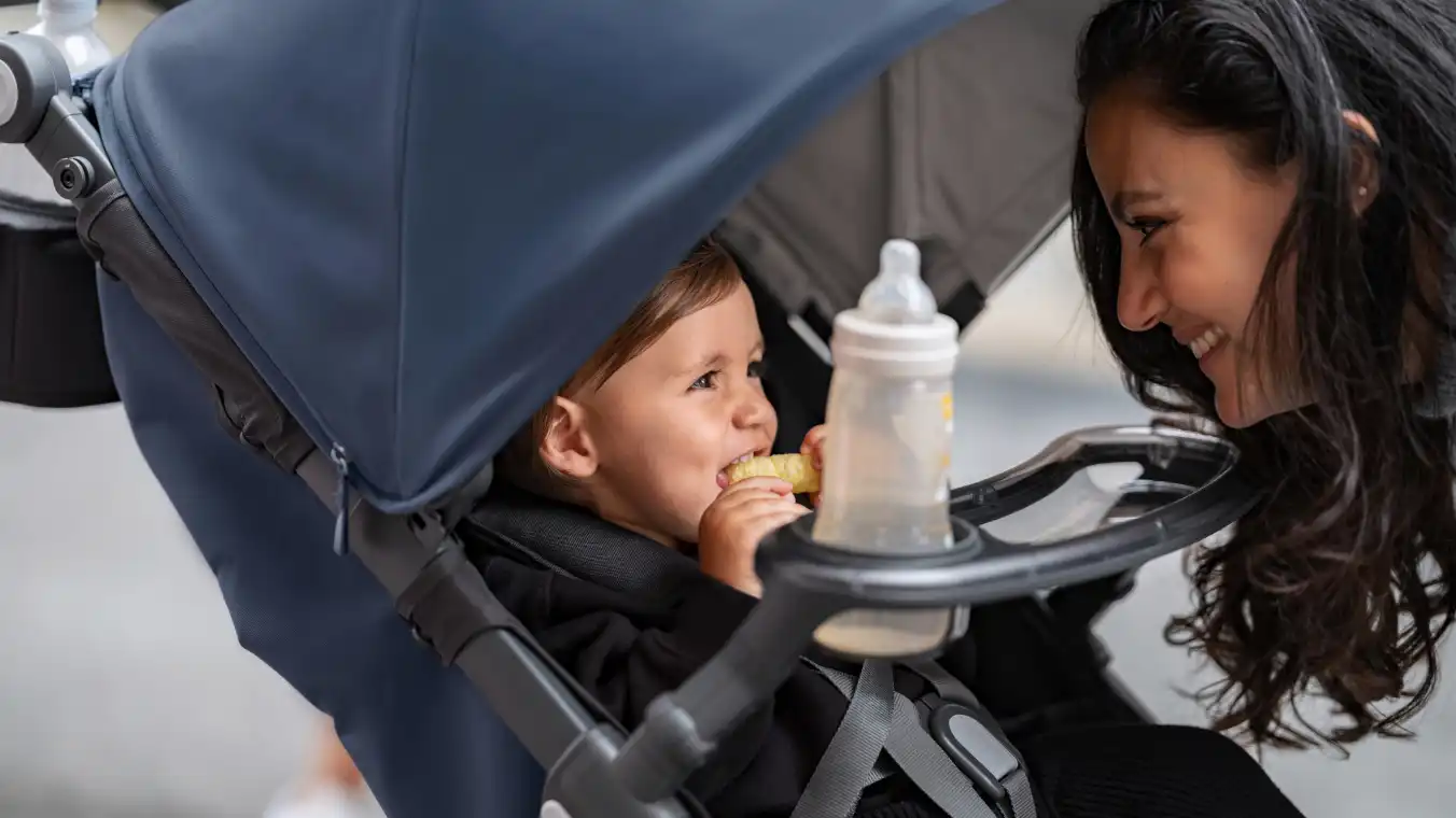 Child in Ridge eating a snack from Snack Tray