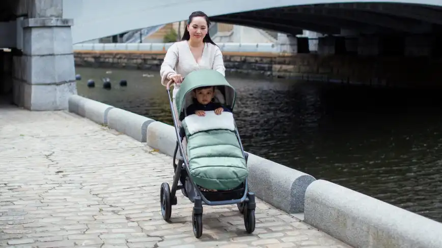 Mom strolling with child in CozyGanoosh