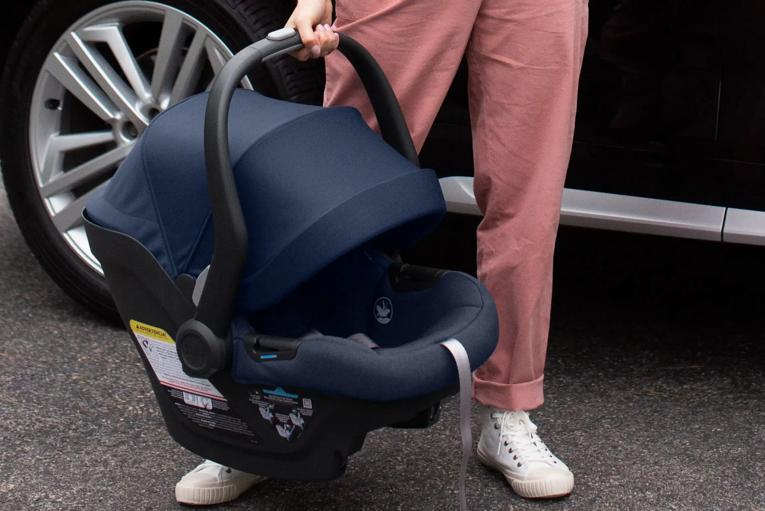 The Mesa Max infant carrier is able to be removed from a stroller travel system with one hand due to the convenient release button on the top of the carrier handle