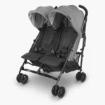 The G-Link V2 (Greyson - charcoal mélange, Carbon frame) features a lightweight aluminum frame that has two side-by-side seats and 4 sets of wheels instead of the traditional six