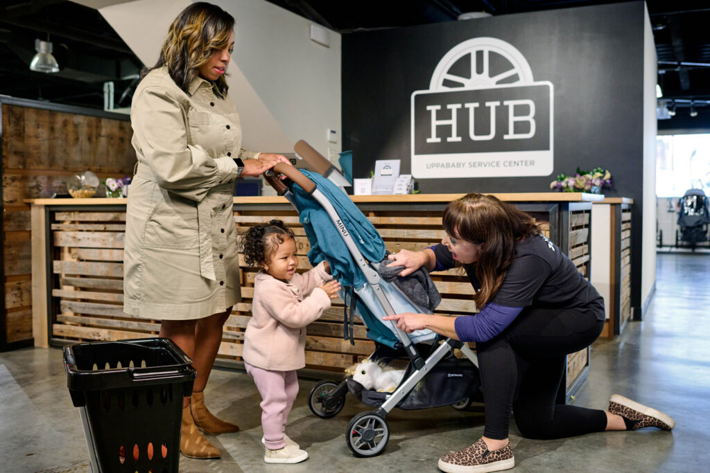 A member of the UPPAbaby Tech Team servicing an UPPAbaby Cruz stroller.