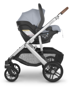 An UPPAbaby Vista V2 Stroller with the UPPAbaby Mesa V2 Infant Car Seat configuration | Gregory | Blue Mélange | Silver Frame | Saddle Leather | Piggyback ride-along board accessory