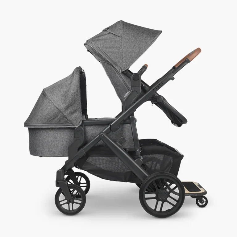 The Vista V2 in a triple configuration, with parent facing toddler seat and Bassinet securely attached with the use of lower adapters, and PiggyBack attached to frame