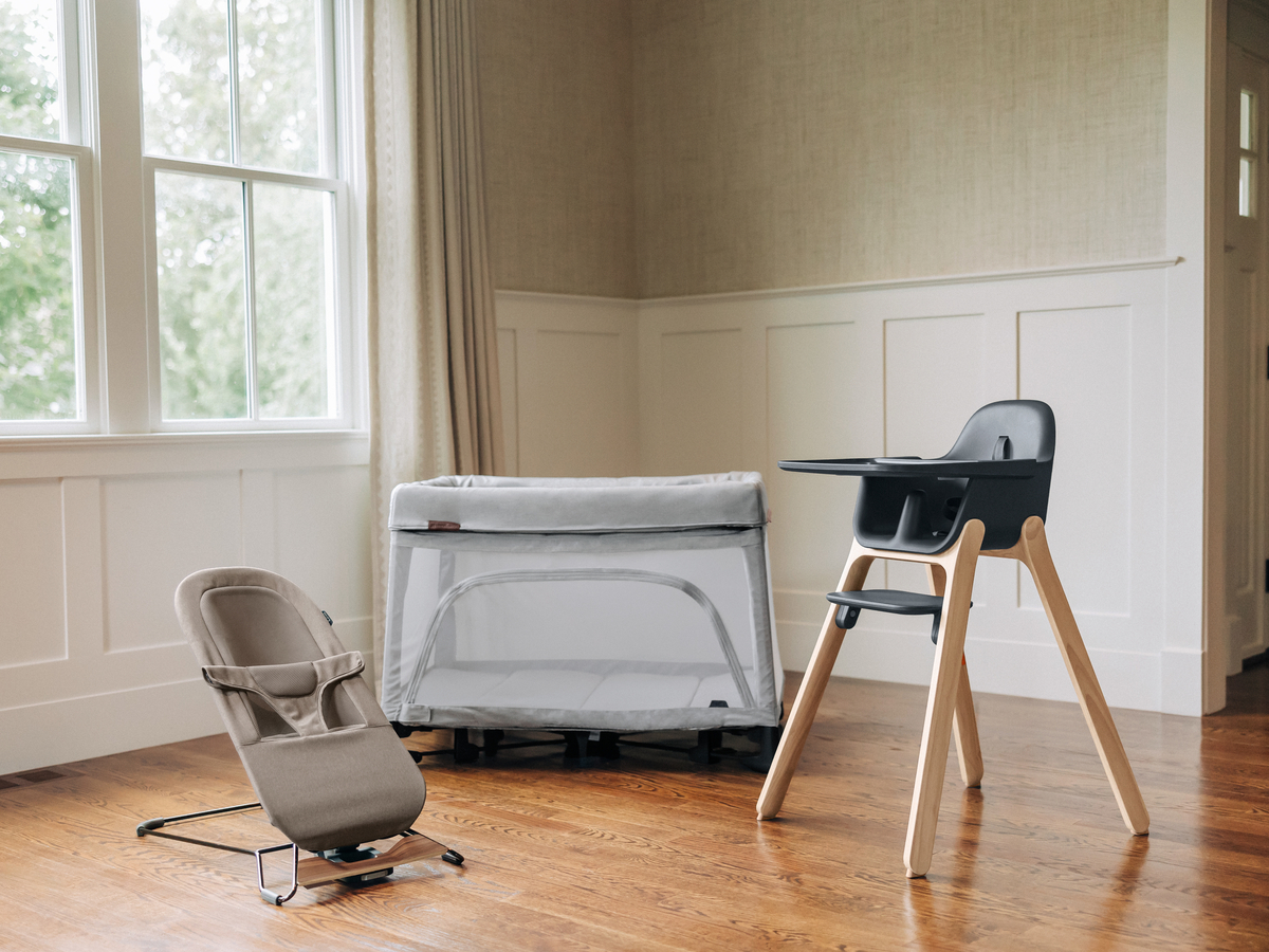 UPPAbaby Remi Playard, Mira Bouncer, and Ciro High Chair displayed within home, highlighting UPPAbaby's full in-home line collection