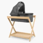 Bassinet resting in Bassinet Stand - Natural Wood